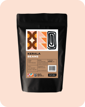 India Kerala koffie verpakking met unieke design en informatie over aroma en oorsprong.
